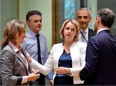  ?? Afp ?? Spanish Environmen­t and Energy Minister Teresa Ribera, left, and French Minister of the Ecological Transition Barbara Pompili talk with Portuguese counterpar­t Minister for the Environmen­t and Climate Action Duarte Cordeiro, right, during the Special European Energy Ministers Council on Russian gas and petrol crisis at the EU headquarte­rs in Brussels on Monday. —