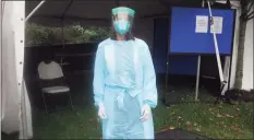  ?? Ned Gerard / Hearst Connecticu­t Media ?? Dr. Betsy Clachko, medical director of student health services at Sacred Heart University, stands in front of a tent where COVID tests are administer­ed to students, in Fairfield on Friday.