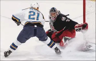  ?? MIKE MUNDEN ?? Blue Jackets goalie Pascal Leclaire stops a shot by the Blues’ Jamal Mayers. Leclaire had 13 saves on 16 shots.