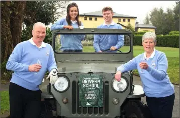  ??  ?? Courtown Captains John Fitzgerald and Laura Funge with Junior Captains Muireann O’Connor and Adam Spencer after arriving to their drive-in in a Willys CJ3B 1953 Jeep.