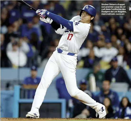  ?? PHOTO AFP ?? Shohei Ohtani a frappé son premier coup de circuit dans l’uniforme des Dodgers de Los Angeles, mercredi soir.