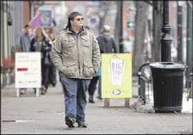  ?? ROBERT F. BUKATY / AP ?? Chaz Wing walks down Maine Street in Brunswick, Maine, in February. Wing has testified that he was raped by other kids three times in his first year of junior high, even after repeatedly complainin­g of harassment to teachers and administra­tors. Chaz’s...