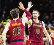  ?? JASON MILLER / GETTY IMAGES ?? All-Star forward Kevin Love (with Cavaliers teammate Cedi Osman) is hoping to break down stigmas about men’s mental health by talking about his own after suffering a panic attack during a game against Atlanta last year. “I’m getting there,” Love said. “It’s still a work in progress.”