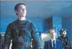  ?? Ben Rothstein
20th Century Fox ?? MILES Teller, left, plays Reed Richards to Tim Blake Nelson’s Dr. Allen in the movie.