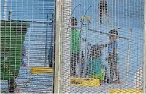  ?? PHOTOS: REUTERS ?? Children play in the Australian-run detention centre on Nauru. Women, children and families on Nauru will get priority in a deal which will see the United States take asylum seekers from Australia.