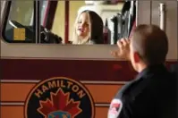 ?? BARRY GRAY, THE HAMILTON SPECTATOR ?? Three-year-old Hunter McCrea checks out the view from the driver’s seat in a fire truck, as firefighte­r dad Tim McCrea watches.
