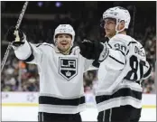  ?? MATT KROHN — THE ASSOCIATED PRESS ?? Kings center Pierre-Luc Dubois, right, celebrates with Kevin Fiala after scoring a goal Thursday at Minnesota.