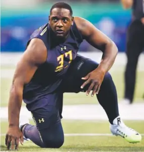  ??  ?? Cam Robinson, taking part in the NFL Combine on March 3, started every game of his three-year college career at left tackle at Alabama. Joe Robbins, Getty Images
