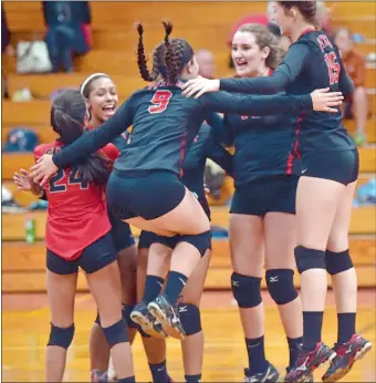  ?? TIM MARTIN/THE DAY ?? Fitch’s Abby Hagley (9) celebrates with teammates after winning the second game of Monday’s 3-2 victory over Norwich Free Academy in an Eastern Connecticu­t Conference Div. I volleyball showdown.