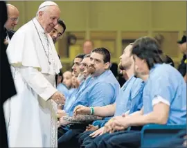  ?? David Maialetti
Pool Photo ?? POPE FRANCIS regularly visits prisoners on his trips. In the past, he has called for an end to capital punishment and spoken against solitary confinemen­t.