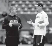  ?? JOSE CARLOS FAJARDO/STAFF ?? Todd Downing, left, earned a promotion from Raiders quarterbac­ks coach to offensive coordinato­r.