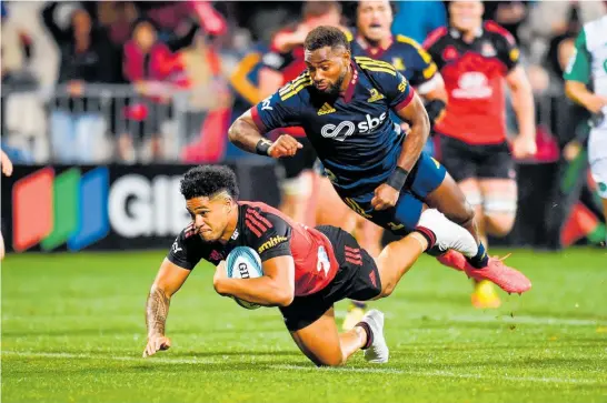  ?? Photo / Photosport ?? Leicester Fainga’anuku scores a try for the Crusaders in the tackle of Mosese Dawai.