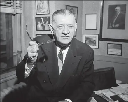  ?? WARREN M. WINTERBOTT­OM — THE ASSOCIATED PRESS FILE ?? In this Feb. 13, 1957, photo, NFL Commission­er Bert Bell gestures in his office in Philadelph­ia. His creation, the NFL draft, has become an industry unto itself and the league’s third-most popular annual event behind the Super Bowl and opening weekend.