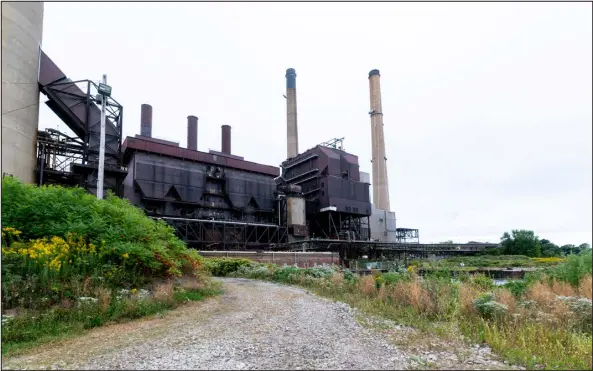  ?? PHOTOS BY DANIEL LOZADA — THE NEW YORK TIMES ?? By tapping into state and federal subsidies and using a legal maneuver to shift environmen­tal liability, developers seek to turn decayed power plants once considered community albatrosse­s into potential assets for economic growth.