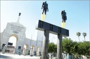  ?? MARK RALSTON/AFP ?? An Olympic-themed monument stands in front of the Los Angeles Memorial Coliseum in California on February 22.