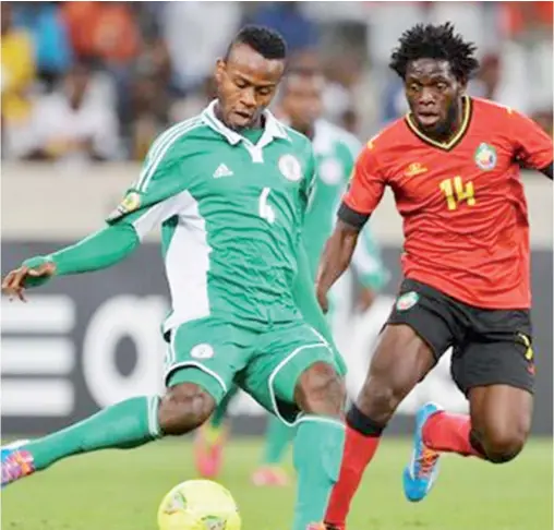  ??  ?? Ugonna Uzochukwu of Nigeria evades a challenge from Diogo Alberto of Mozambique during the 2014 CAF African Nations Championsh­ips Group A match at Cape Town Stadium