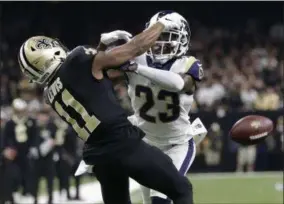  ?? GERALD HERBERT — ASSOCIATED PRESS ?? The Rams’ Nickell Robey-Coleman, right, breaks up a pass intended for the Saints’ Tommylee Lewis during the NFC championsh­ip game in New Orleans last season.