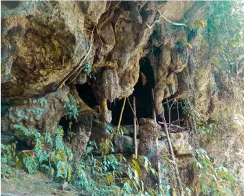  ??  ?? CAVE LIFE. The Tau’t Bato tribe finds comfort inside this cave in Singnapan Valley especially during rainy season. (Photo/Municipal Tourism Office)