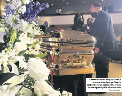  ?? Bebeto Matthews ?? > Martin Luther King III takes a moment by George Floyd’s casket before a memorial service for George Floyd in Minneapoli­s