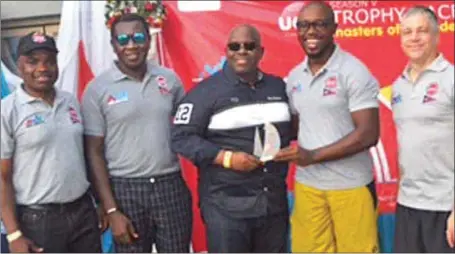  ??  ?? L-R: Managing Director MDS Logistics, Solomon Aigbavboa, GMD/CEO UACN Plc., Larry Ettah, Managing Director UPDC, Hakeem Ogunniran presenting prizes to winners at Season 5 of the UAC Trophy Race sponsored by MDS Logistics at the Lagos Yacht Club last...