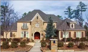  ?? PHOTOS BY LINDA GARNER-BUNCH/Arkansas Democrat-Gazette ?? This luxurious home is fully furnished, including custom window treatments and nine nat-screen TVs. Every bedroom has a private bath, and there are a variety of living spaces to suit any lifestyle.