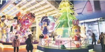  ??  ?? Photo shows a Christmas decoration displayed outside a shopping mall in Beijing. The World Bank yesterday raised its forecast for China’s economic growth in 2017 to 6.8 per cent from 6.7 per cent it projected in October, as personal consumptio­n and...