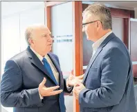  ?? SUBMITTED PHOTO ?? Robert Irving, left, from Cavendish Farms talks to Economic Developmen­t Minister Heath MacDonald during a meeting in Charlottet­own Wednesday to discuss issues about NAFTA negotiatio­ns coming later this summer.