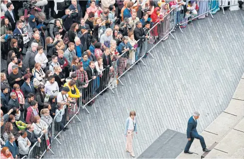  ?? AFP ?? London Mayor Sadiq Khan, right, leads a vigil in Potters Fields Park in London on Monday to commemorat­e the victims of the terror attack on London Bridge and at Borough Market.