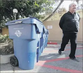  ?? Myung J. Chun Los Angeles Times ?? TONY DONATO, president of a condo associatio­n in Tarzana, says the company that handles its trash has repeatedly missed recycling pickups.