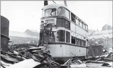  ??  ?? Above from left, Sheffield Firvale tram terminus; a crew based at Holme Lane Depot Hillsborou­gh pose for a photograph; the sad sight of a tram at the end of its days in a Sheffield tram at breakers yard after withdrawal.