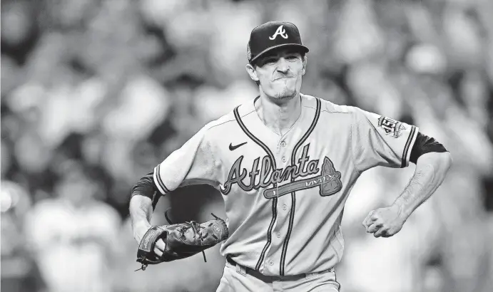  ?? ELSA/GETTY IMAGES ?? Atlanta’s Max Fried celebrates after retiring the side against the Astros during the sixth inning of Game 6.