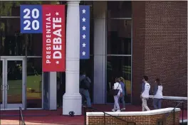  ?? JULIO CORTEZ — THE ASSOCIATED PRESS ?? People approach an entrance Tuesday to the Curb Event Center at Belmont University in Nashville, Tenn., the site of the final presidenti­al debate between Republican President Donald Trump and Democratic candidate and former Vice President Joe Biden. The debate is scheduled for Thursday.