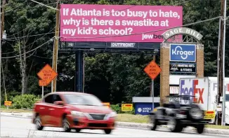  ?? MIGUEL MARTINEZ/MIGUEL.MARTINEZJI­MENEZ@AJC.COM ?? Billboards going up around metro Atlanta are challengin­g viewers to fight antisemiti­sm, including in local schools. It’s a reference to incidents in 2021 where graffiti depicting swastikas was found in two Cobb County high schools during the Jewish High Holidays.