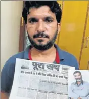  ?? HT ?? Son Anshul with a photo of journalist Ram Chander Chhatrapat­i and his local newspaper of May 30, 2002, carrying the rape report.