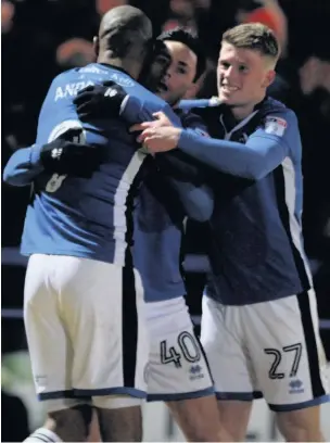  ?? Simon Hall ?? ●●Calvin Andrew and Andy Cannon celebrate Ian Henderson’s winning goal in the FA Cup fourth round replay