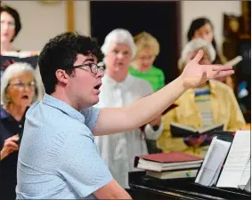  ?? SARAH GORDON/THE DAY ?? Will Cooper leads a choir rehearsal at St. James Episcopal Church in New London.