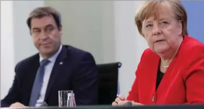  ?? REUTERS ?? Markus Söder, líder de la CSU y Angela Merkel, canciller de Alemania.