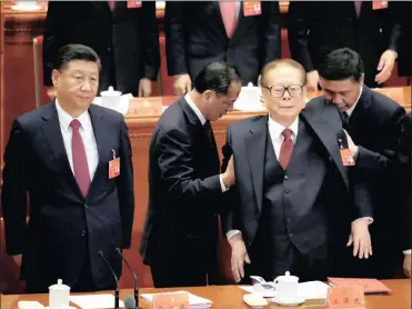  ?? PHOTO: REUTERS ?? (Left to right) Chinese President Xi Jinping, former president Jiang Zemin and Chinese Premier Li Keqiang listen to The Internatio­nale at the closing session of the 19th National Congress of the Communist Party of China in Beijing yesterday.