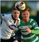  ?? SPORTSFILE ?? Battle: Sean Hoare of Dundalk and Rovers’ Gary Shaw