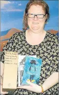  ?? Picture: SID PENNEY ?? ADDING TO THE COLLECTION: Crystal Warren, holds a couple of novels and manuscript­s of renowned author and academic Andre Brink, who died last month