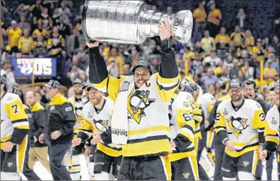  ?? AP PHOTO ?? Pittsburgh Penguins’ Sidney Crosby celebrates with the Stanley Cup after defeating the Nashville Predators in Game 6 of the Stanley Cup Final on June 11, 2017.