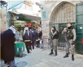  ?? — AP ?? Israeli border policemen stand guard in Old City in Jerusalem on Friday. Israel deployed reinforcem­ents in anticipati­on of Palestinia­n protests over the Trump administra­tion’s recognitio­n of the contested city as the Israeli capital.