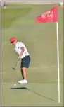  ?? NEWS PHOTO SEAN ROONEY ?? Mery Tarigan of Fanshawe College putts from off the green at the 18th hole during the second round of college nationals Wednesday at Desert Blume Golf Club.