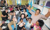  ?? PHOTOGRAPH: BRIAN WITBOOI ?? LEARN AND PLAY: Chanelle Edgar, centre, and Nolitha Mgushelo, right, with students from NMMU and the children at Mthawe Themba Learn and Play Centre in Walmer Township