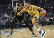  ?? RANDALL BENTON — THE ASSOCIATED PRESS ?? Sacramento Kings center Richaun Holmes (22) guards Warriors guard Stephen Curry during the first quarter of a game in Sacramento on Sunday.