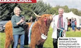  ??  ?? Success Dr Pam Levack and Donald McNaughton with his winning Highland cow