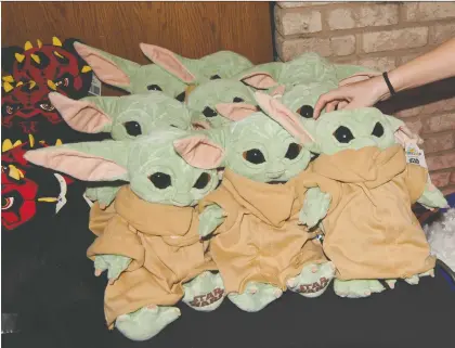 ?? DEVIN DOYLE/THE WASHINGTON POST ?? Merchandis­e from The Mandaloria­n, including “Baby Yoda” plush toys, is finally making its way to the market.
