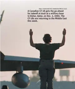  ?? PAUL CHIASSON/ THE CANADIAN PRESS FILES ?? A Canadian CF- 18 gets the go- ahead for takeoff at dusk at a military base in Dohar, Qatar, on Dec. 3, 1990. The CF- 18s are returning to the Middle East this week.