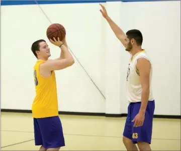  ??  ?? Mountain View senior Tanner Buchanan, left, shoots over junior Julian Duran at a practice earlier this year.