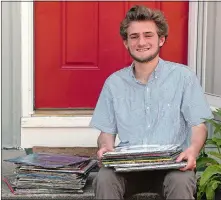  ?? DANA JENSEN/THE DAY ?? Waterford High School senior Connor Elci, who loves music, at his home with his collection of record albums.